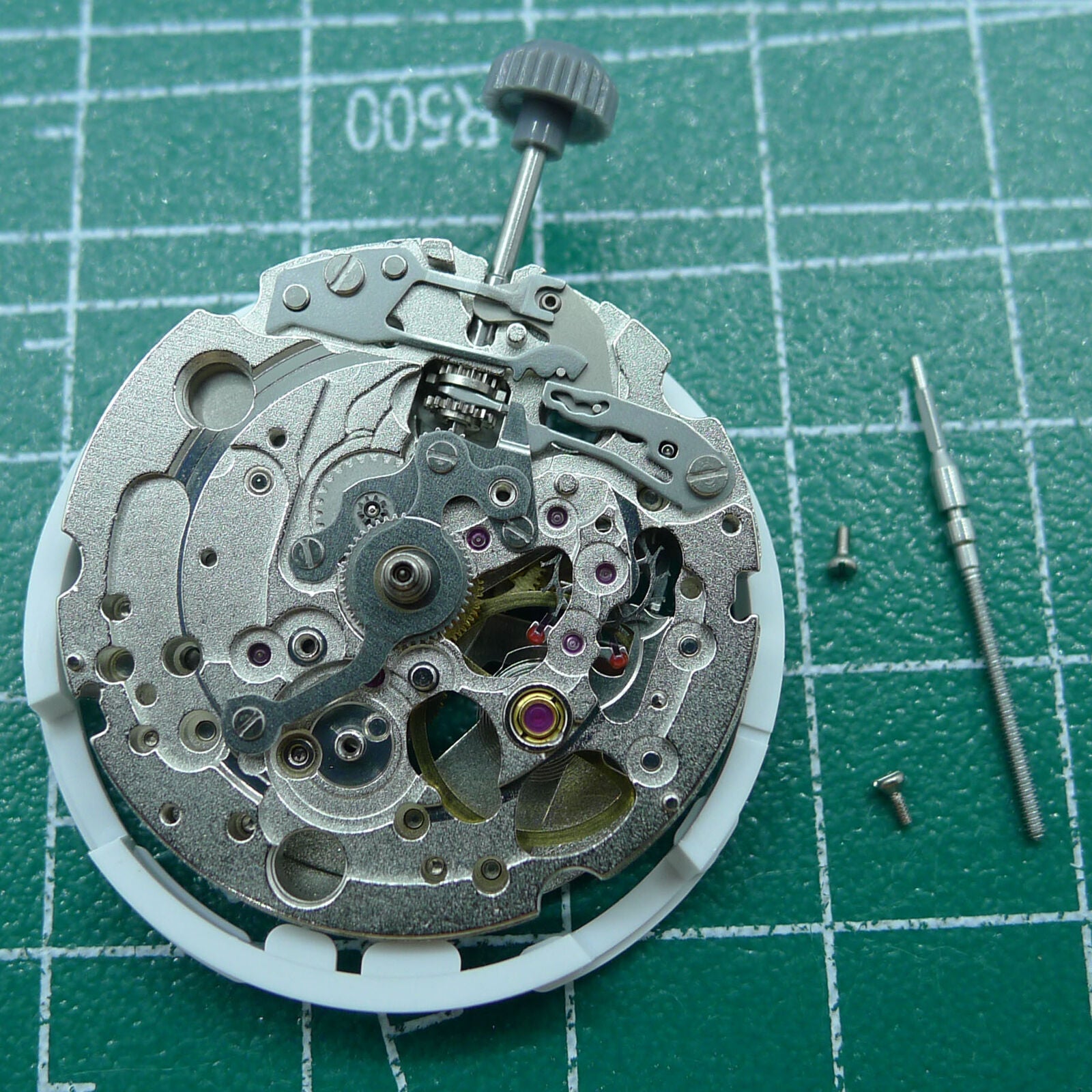 Japan Miyota 82S0 silver plated hollow automatic watch movement showcasing mechanical precision and craftsmanship.