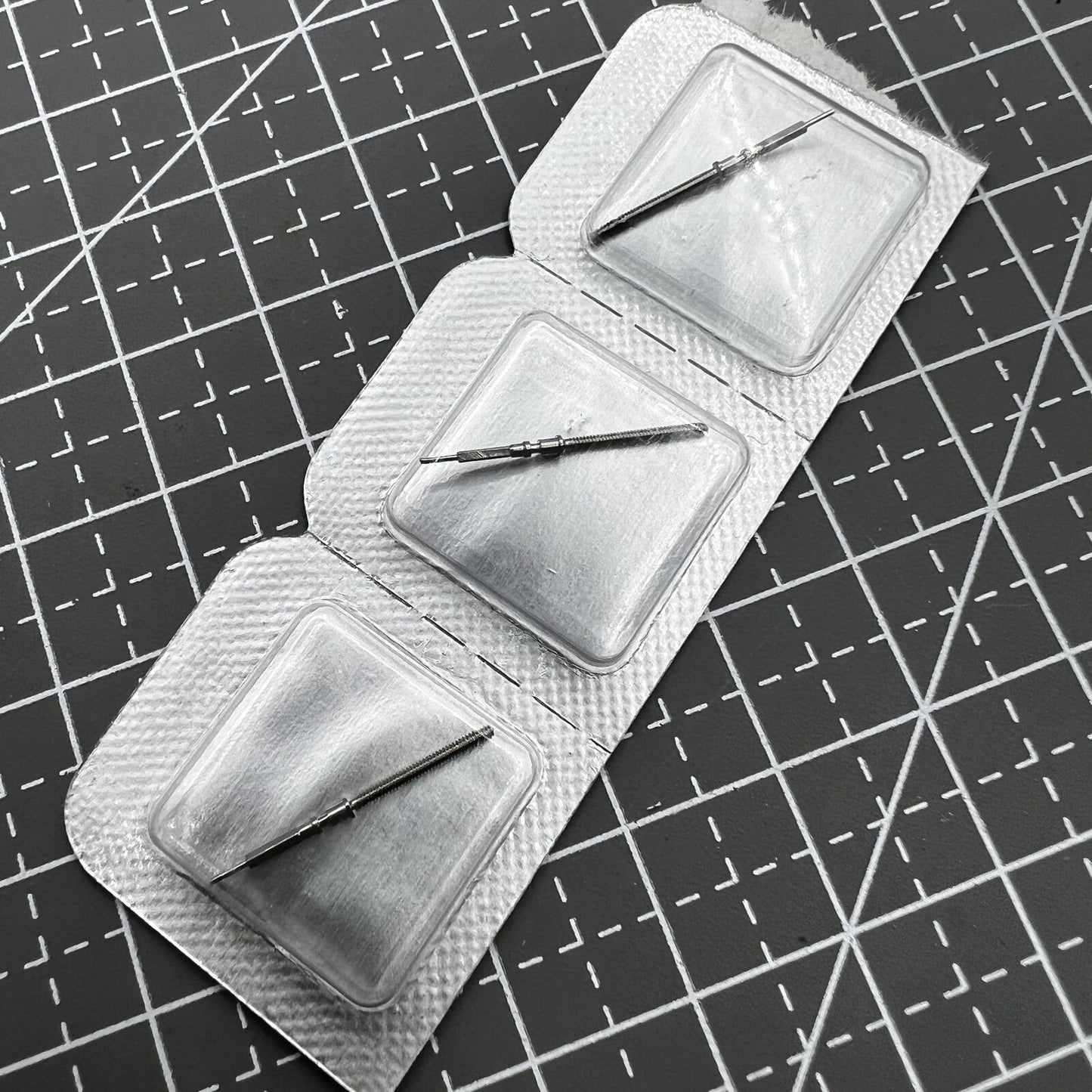 Original Omega 8500 watch winding stem designed for precise movement repair in luxury timepieces.