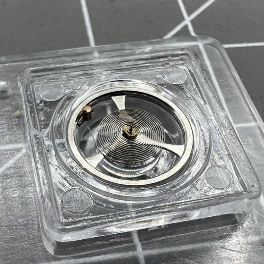 Balance wheel with hairspring for Movement 7009 Asian watch, precision fit for smooth timekeeping.