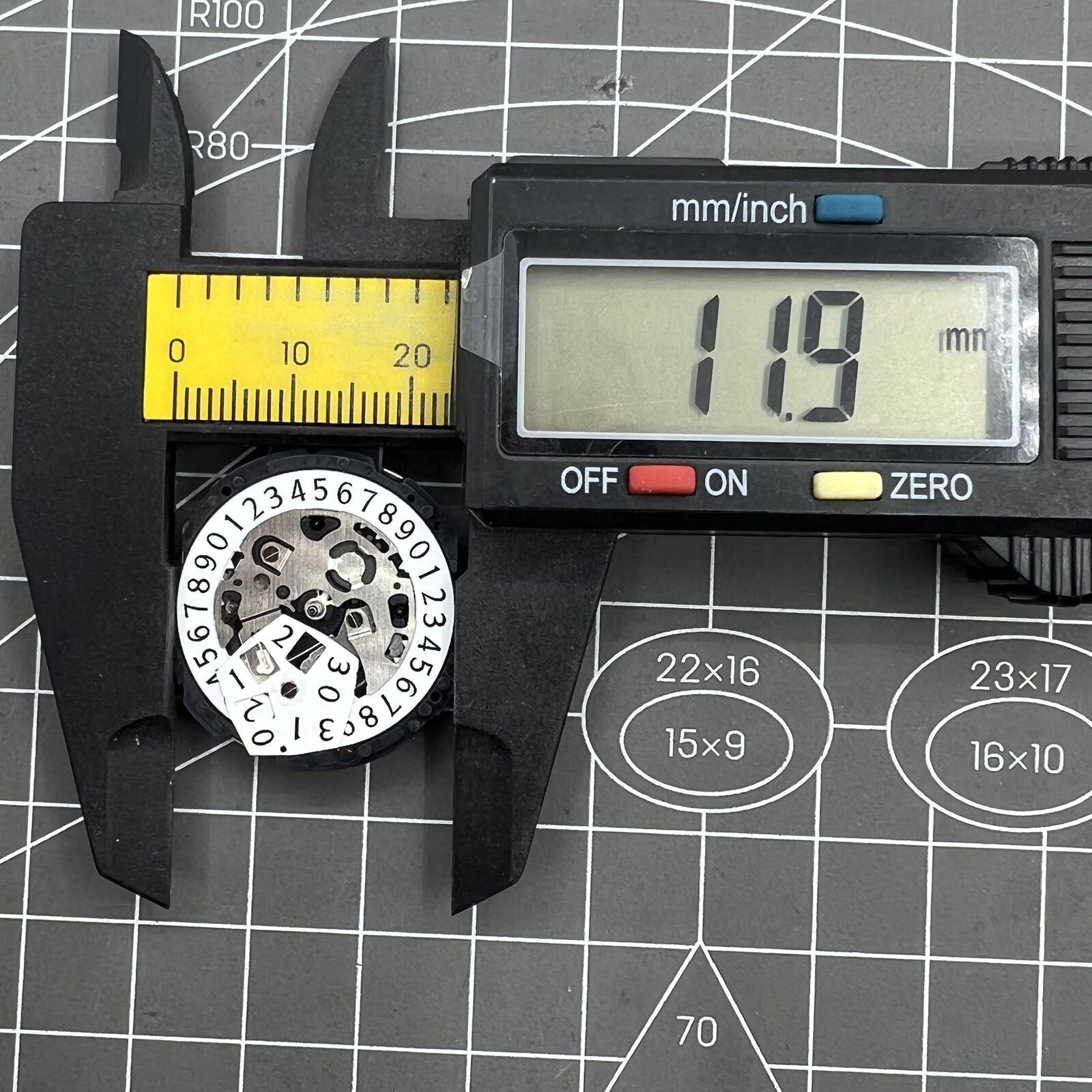 Epson YM04A quartz watch movement with big date display, precise timekeeping for watch repairs.