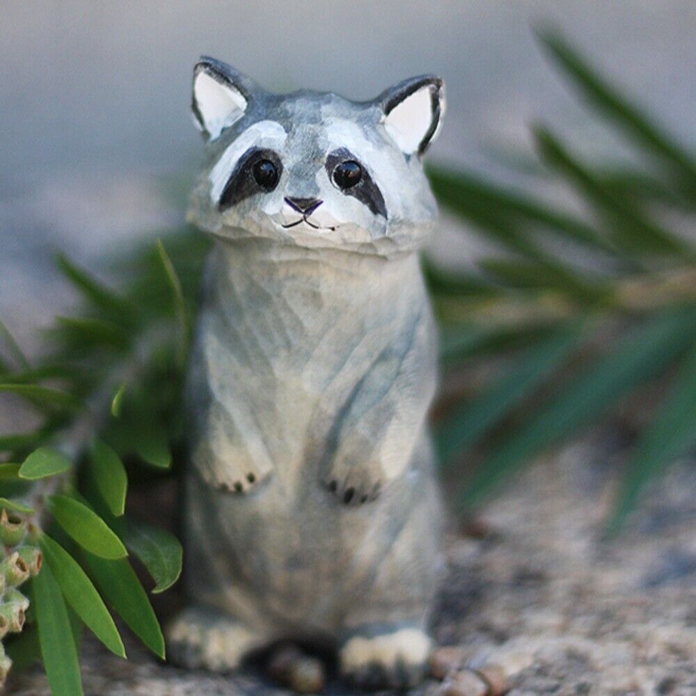 Handcrafted raccoon wooden figurine, charming decorative artwork for home or office display.