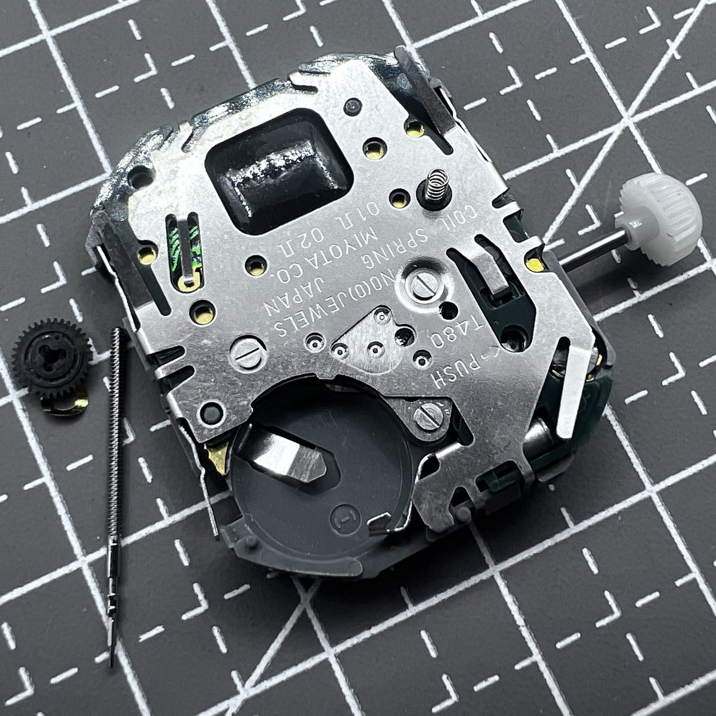 Japan Miyota T480 quartz watch movement with three hands and date display for accurate timekeeping.