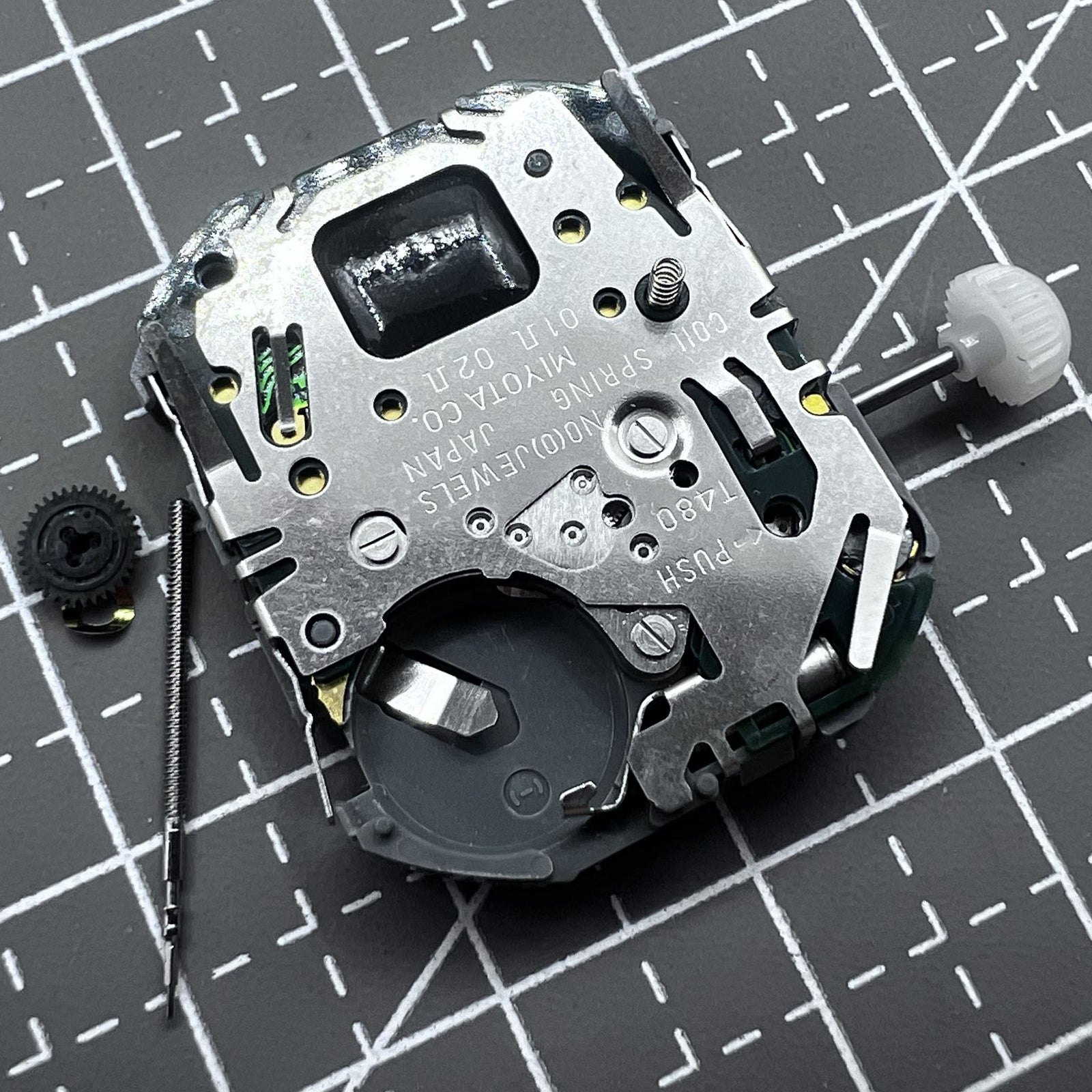 Japan Miyota T480 quartz watch movement with three hands and date display for accurate timekeeping.