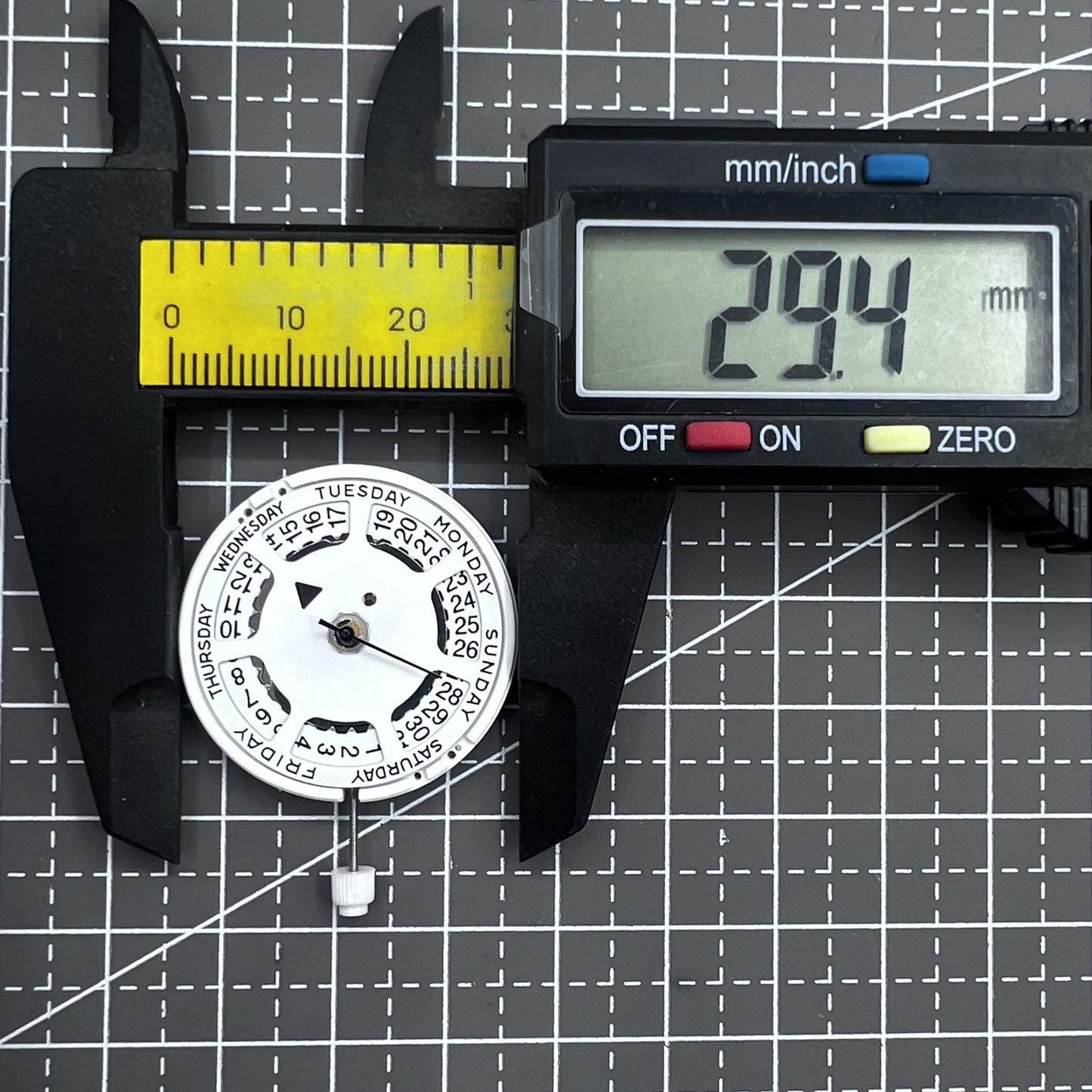 Swiss ISA 1198 quartz watch movement with day and date function for precise timekeeping.