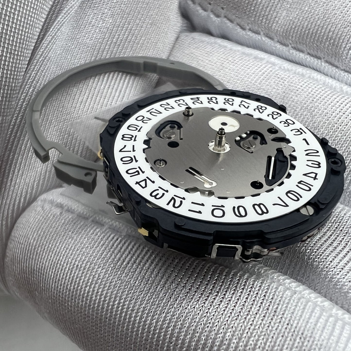 Hattori Epson TMI YM64A quartz watch movement, Japan-made, ensuring precise timekeeping for watch repairs.