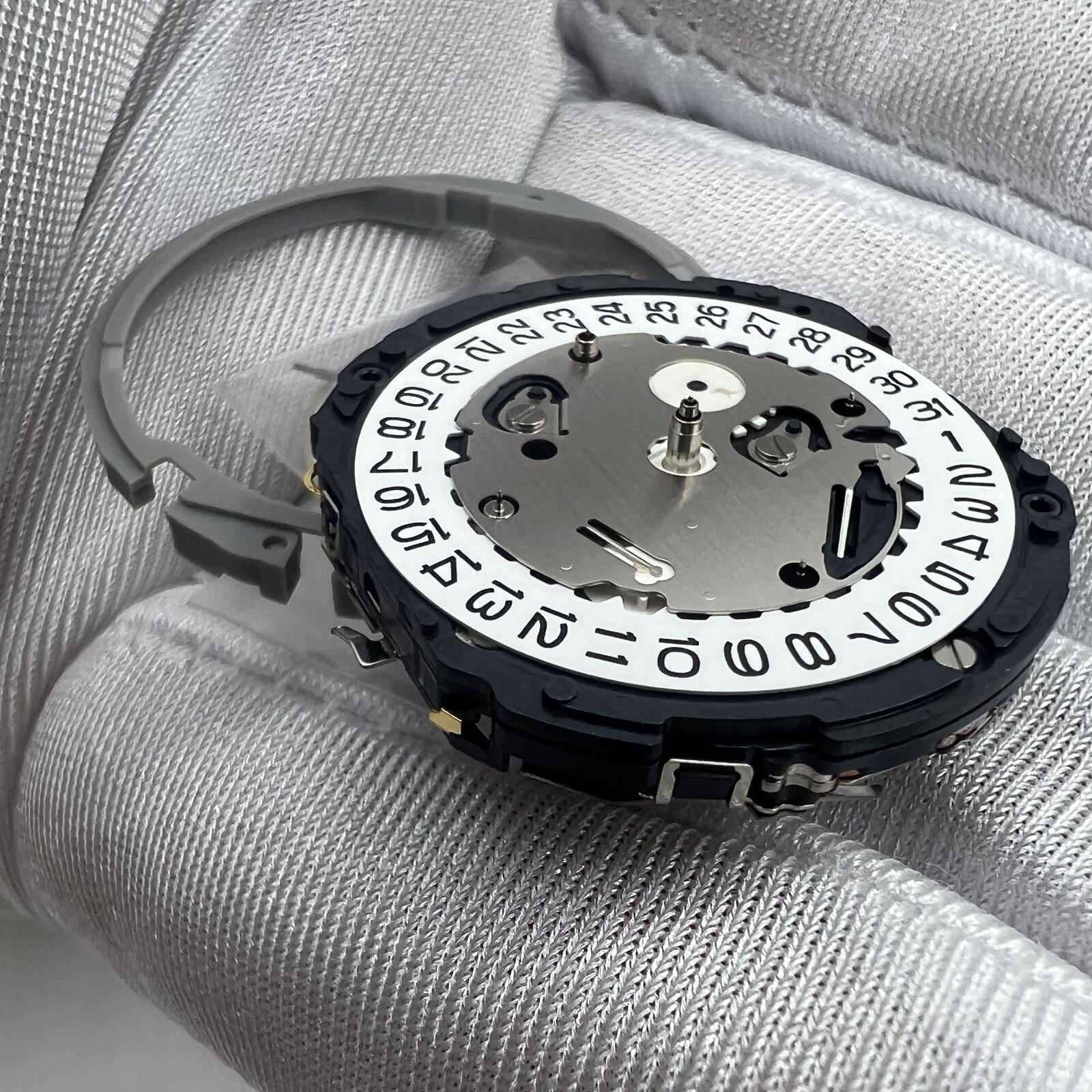 Hattori Epson TMI YM64A quartz watch movement, Japan-made, ensuring precise timekeeping for watch repairs.