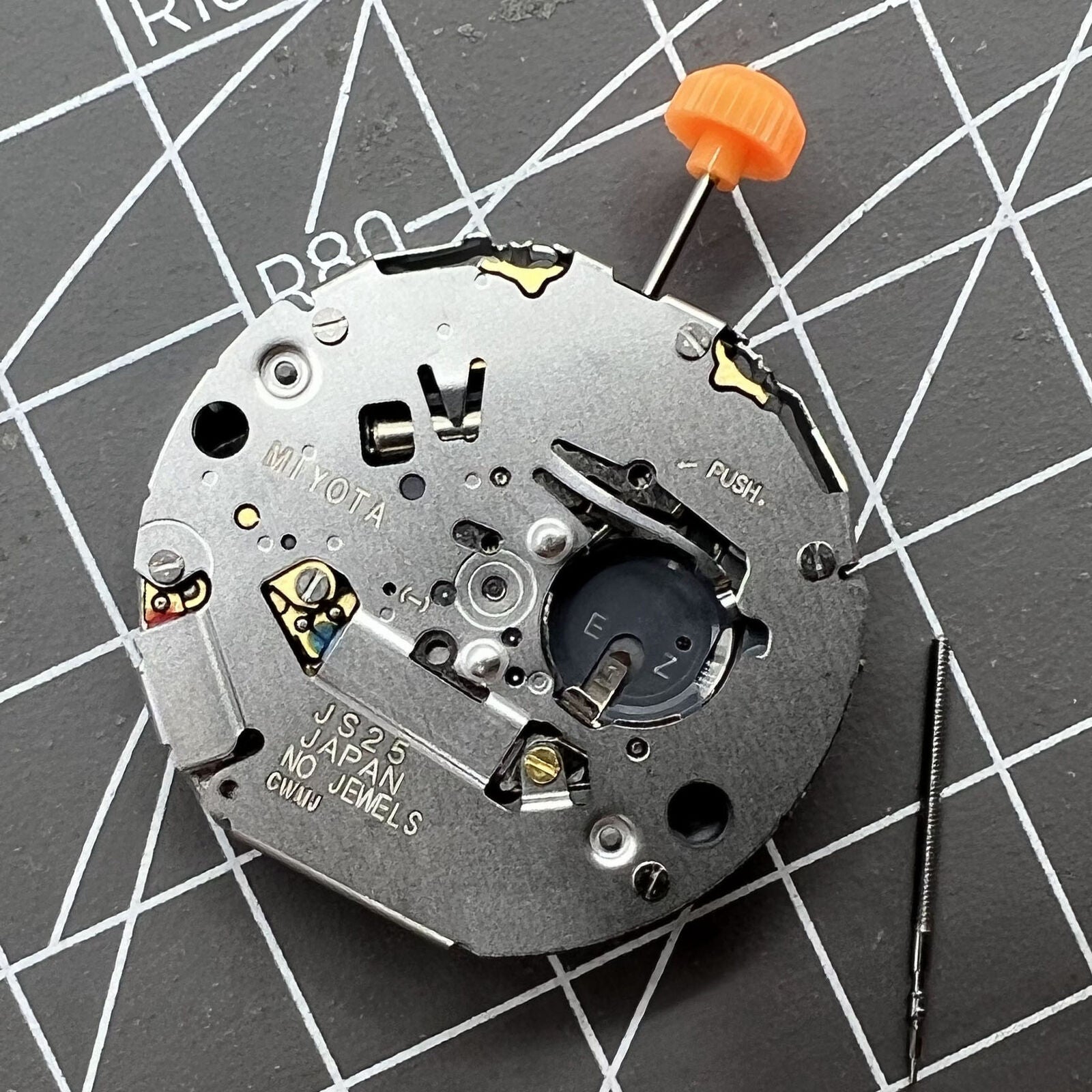 Miyota JS25 Japan Quartz watch movement with small second subdials and date display at 3 o'clock.
