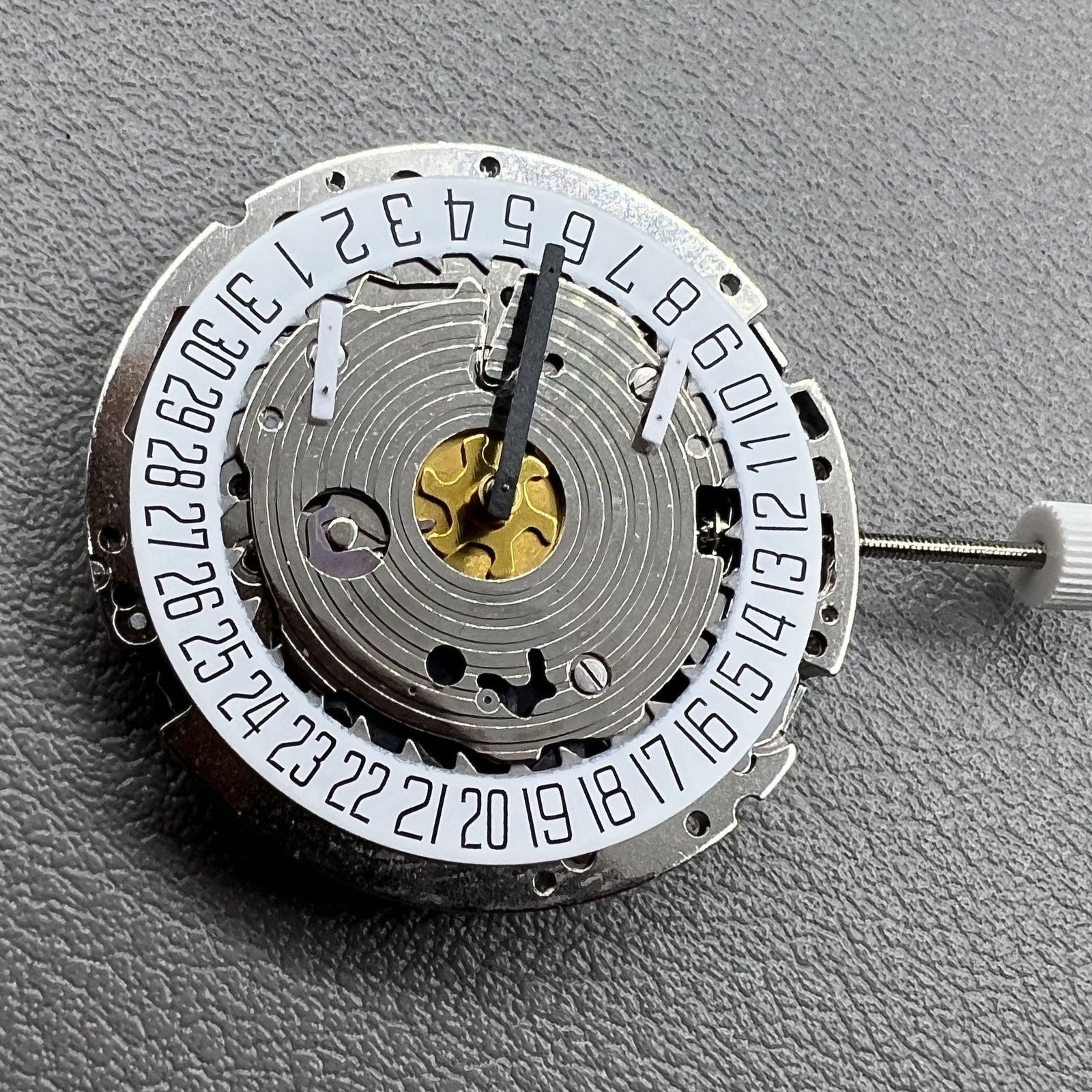 Swiss Made ISA 8171 silver quartz watch with 5 hands and date at 6 o'clock, elegant design.