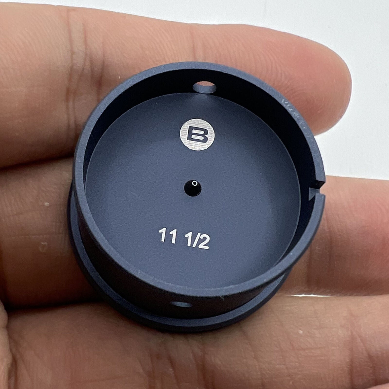 Bergeon 7100-11 1/2 watch movement holder securing Swiss watch parts for precise repairs.