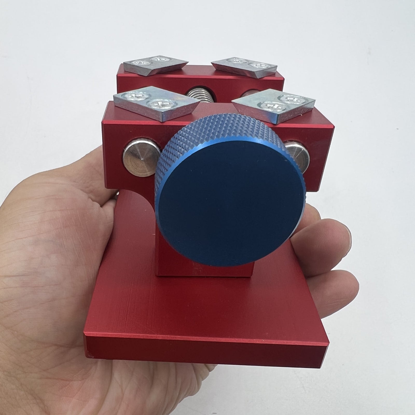 Professional watch bezel remover and case back opener tool for precise watch repair workbench.