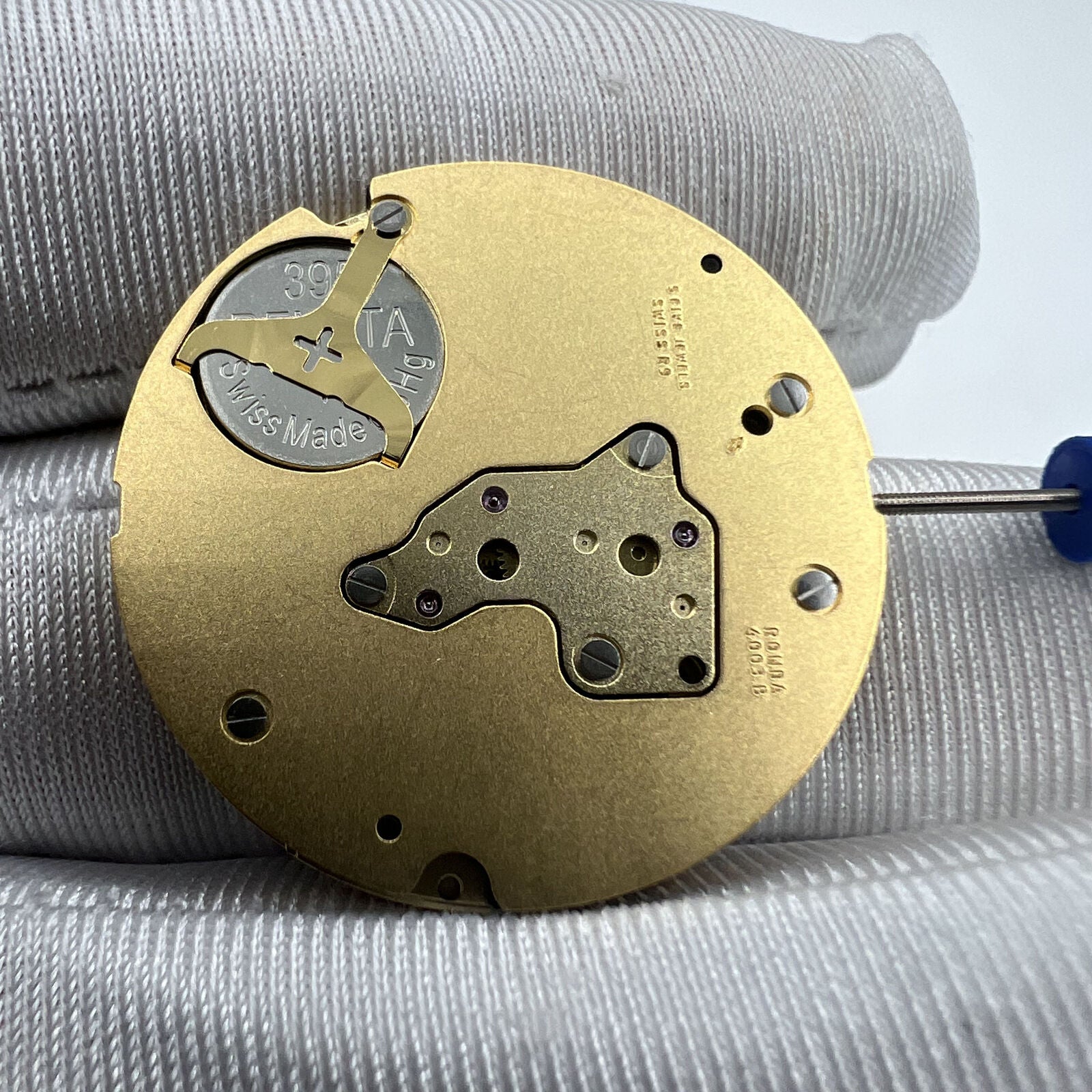 Swiss Ronda 4003B quartz watch movement with date at 12 for precise accessory repairs.