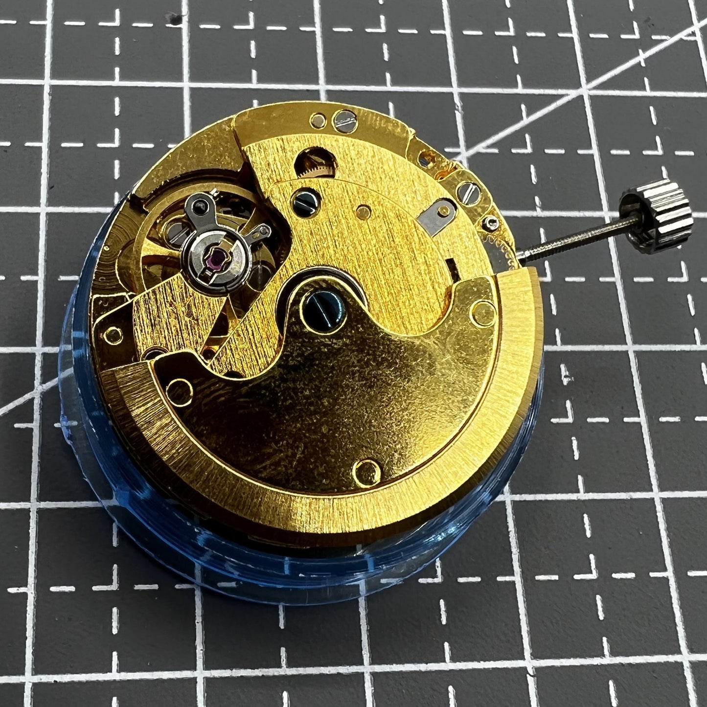 Polished gold Tianjin T16 mechanical watch movement, compatible with Miyota 8200, precision replacement part.