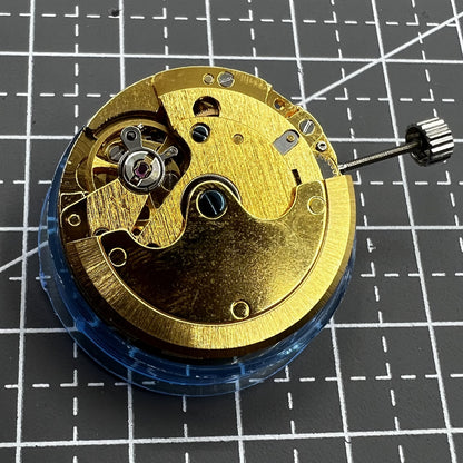 Polished gold Tianjin T16 mechanical watch movement, compatible with Miyota 8200, precision replacement part.