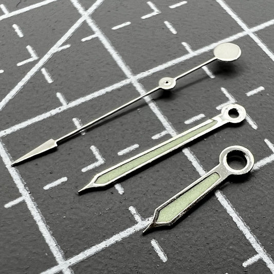 Green luminous watch hands with silver trim for Miyota 2035, 2115, 2105, 2305, 2315 movements.
