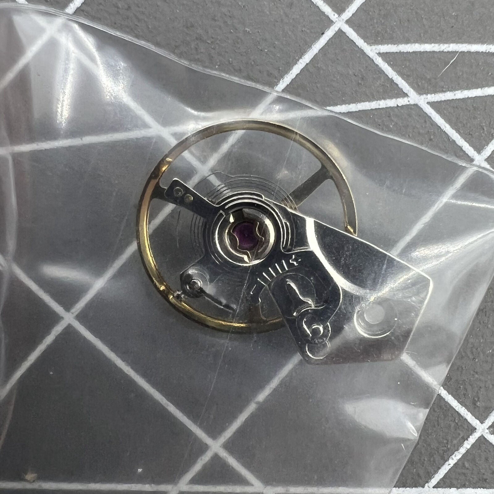 Balance wheel with splint for Dandong 7750 watch movement, 28800vph precision timing component by Dandong.