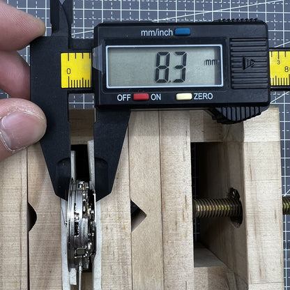 Dandong 7753 automatic watch movement with small second dial at 9 o'clock, enhancing precision timekeeping.
