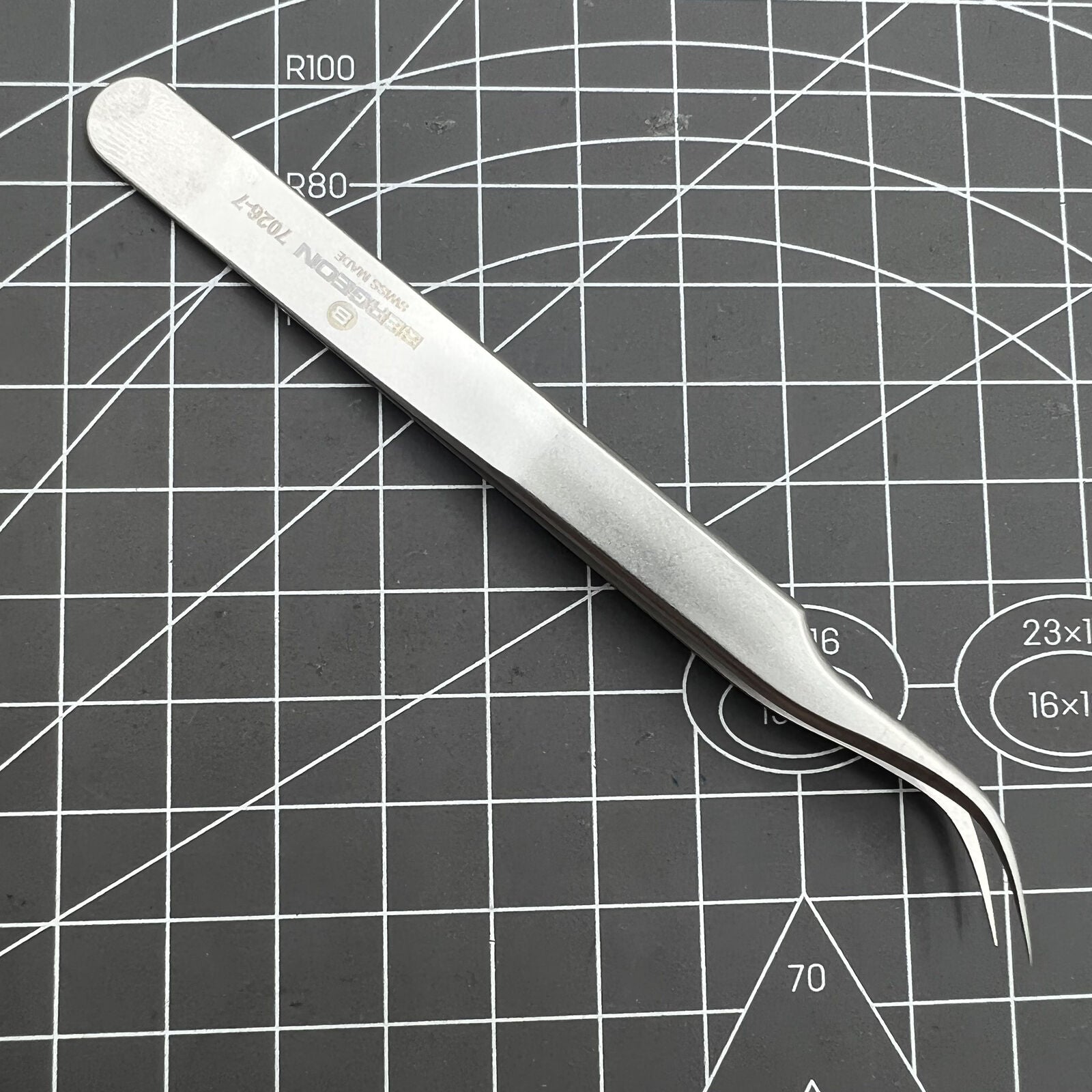Swiss Bergeon 7026-7 antimagnetic tweezer with fine curved points for precise watch accessory handling.