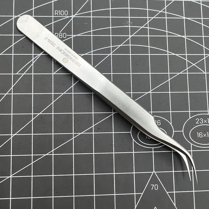 Swiss Bergeon 7026-7 antimagnetic tweezer with fine curved points for precise watch accessory handling.