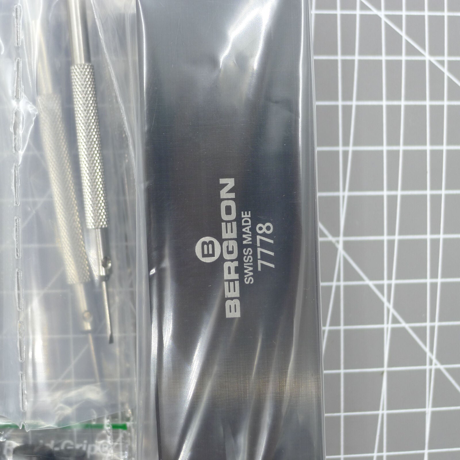 Swiss Bergeon 7778 watch screwdriver set with 6 precision blades and organizer stand for watch repair tasks.