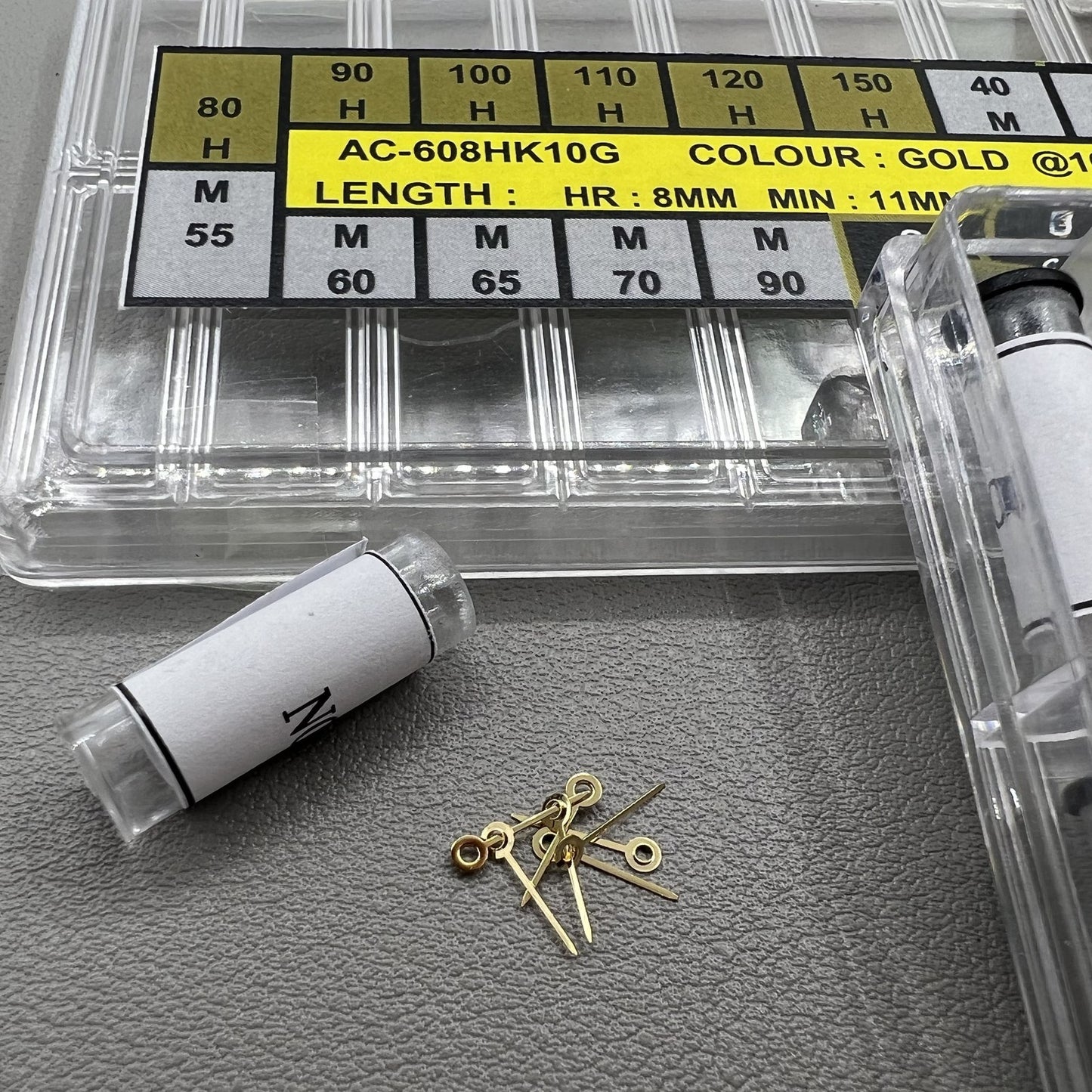 Golden watch hands set in 18 sizes for hour, minute, and second, perfect for precise timepiece repairs.