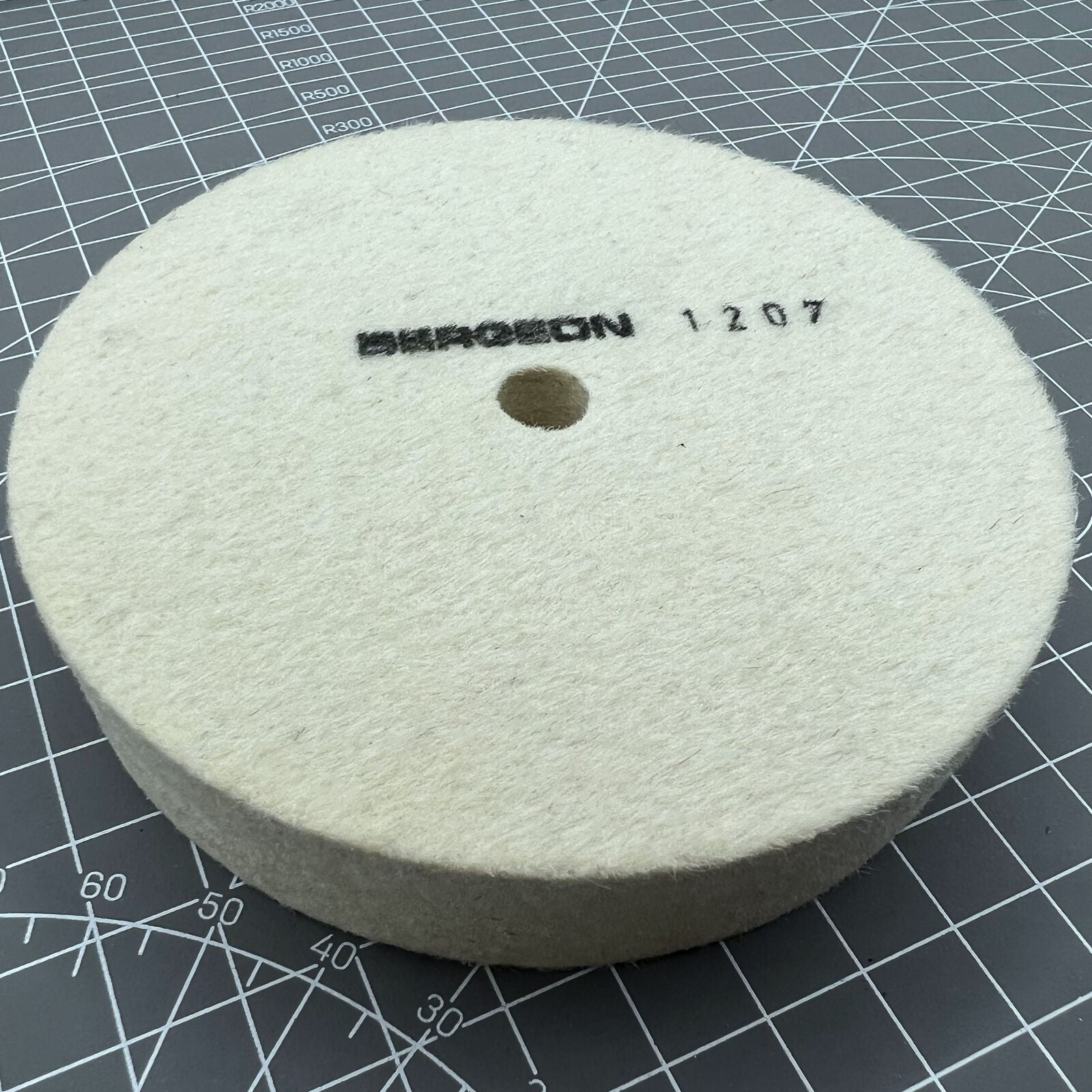 Swiss Bergeon 1207 white felt polishing wheel for watch accessories, precision-crafted for smooth finishing.