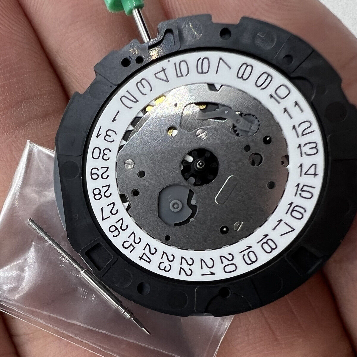 Miyota OS20 quartz watch movement with date display, precision Japanese craftsmanship for watchmakers.