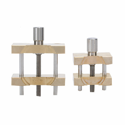 Copper vintage watch movement holder clamp vise, ideal for precise watchmaker repairs and adjustments.