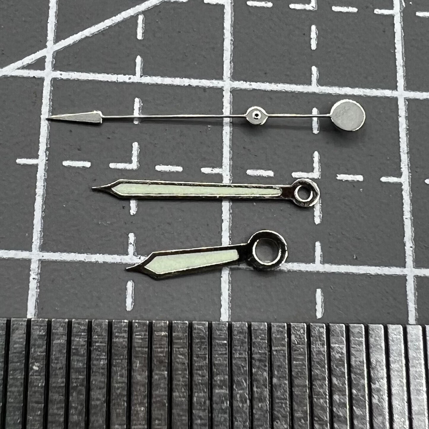 Green luminous watch hands with silver trim for Miyota 2035, 2115, 2105, 2305, 2315 movements.