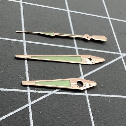 14mm rose gold arrow-shaped luminous watch hands with green glow for ISA 2331 movement.