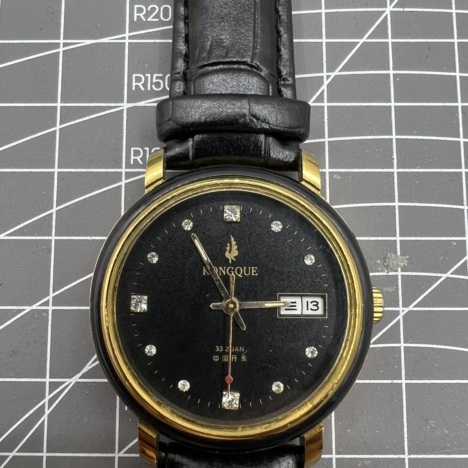 37mm Kongque automatic watch with black dial, double calendar, 33 jewels, and precise mechanical movement for stylish timekeeping.