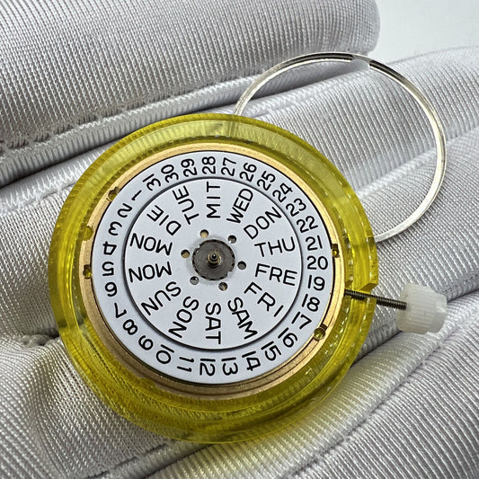 Swiss Made ETA 955.122 quartz watch movement with double calendar and three hands for precise timekeeping.