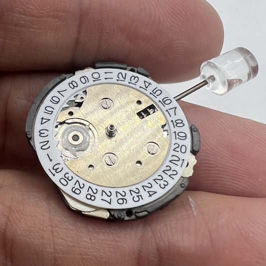 6EC1 quartz watch movement with date at 3, Japan-made repair part for precise timekeeping.