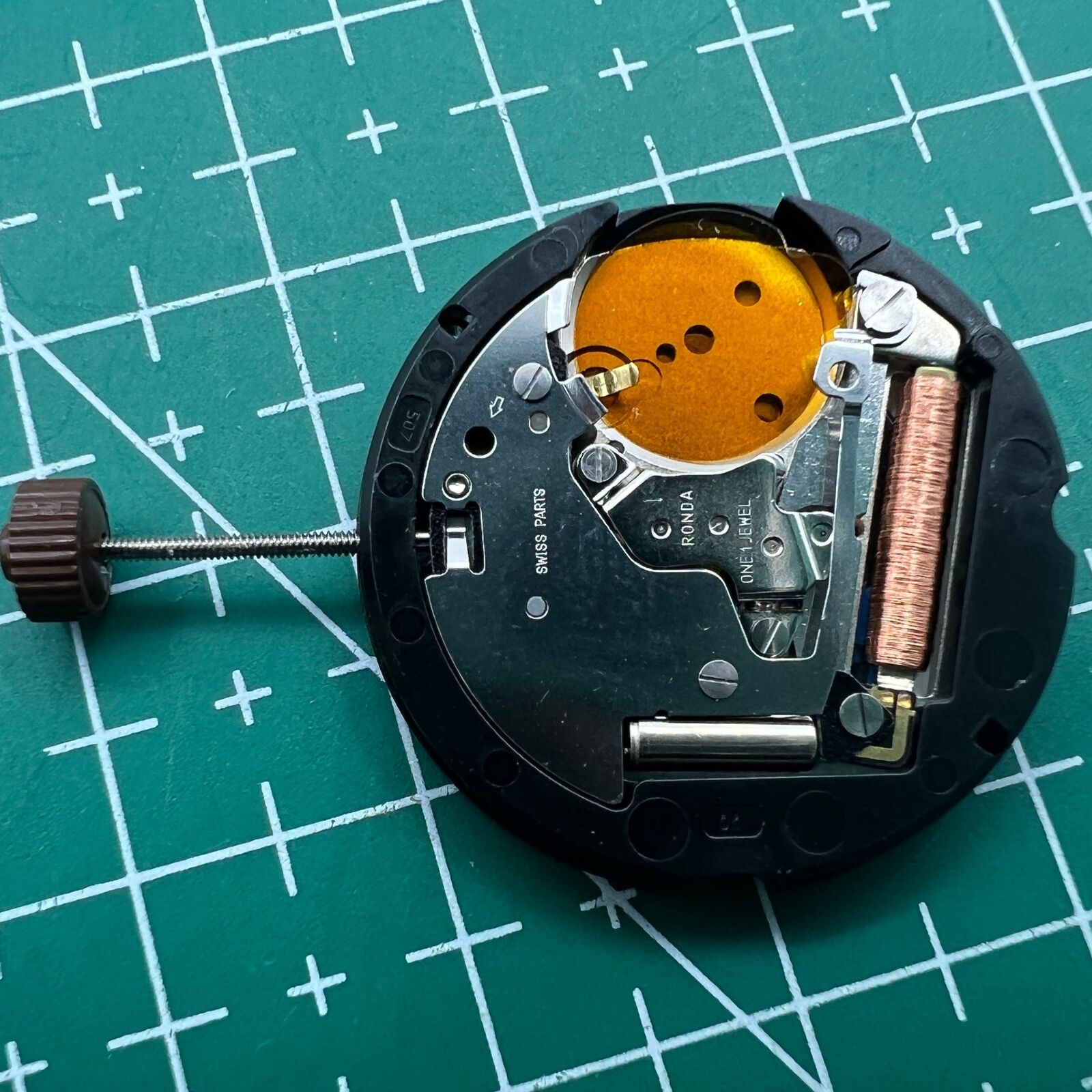 Ronda 507 quartz watch movement by Swiss Part with English date display for precise timekeeping.