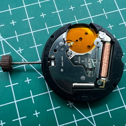 Ronda 507 quartz watch movement by Swiss Part with English date display for precise timekeeping.