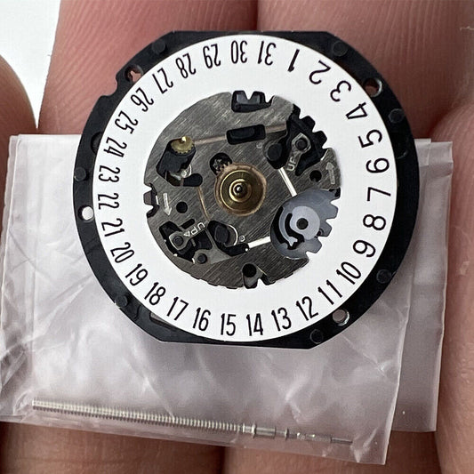 Hattori Epson TMI VX12E quartz watch movement with date display at 3 and 6, Japan-made precision.