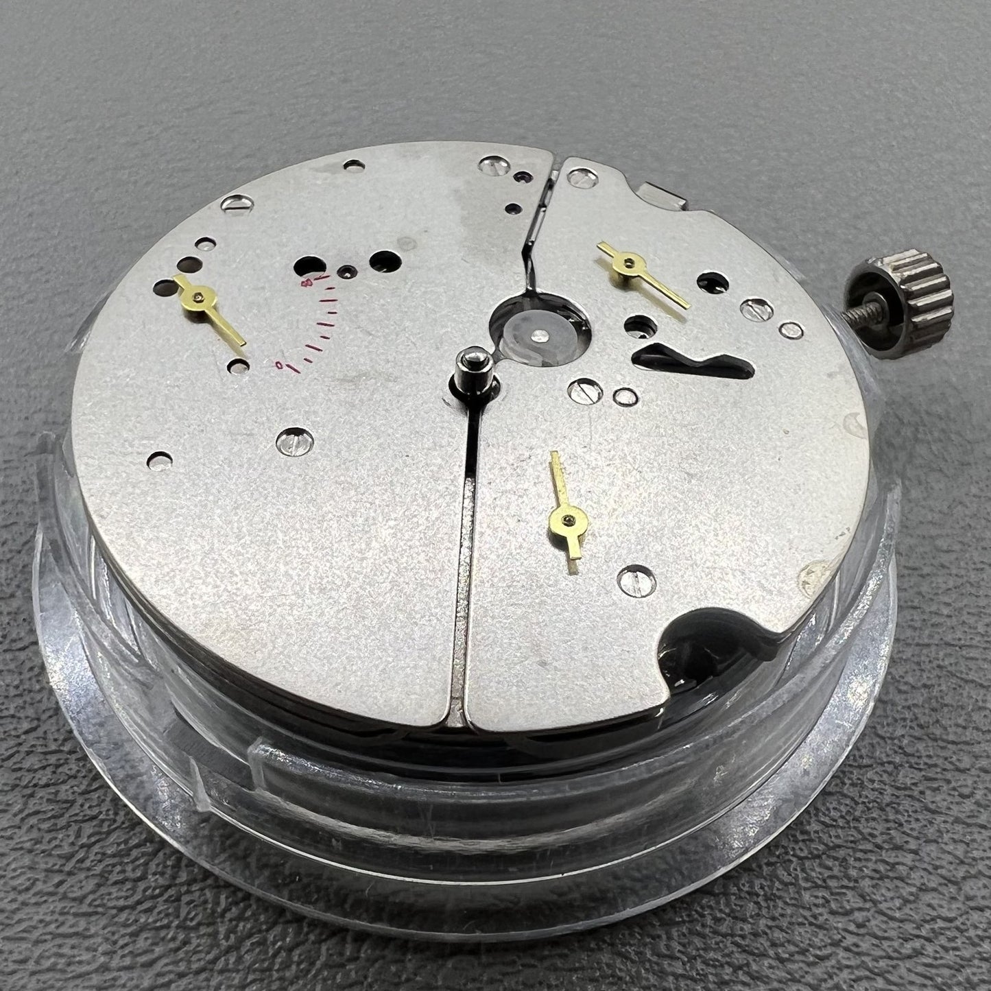 Tianjin ST17 T17 hand-wound watch movement with two hands and power reserve indicator at 10 o'clock.