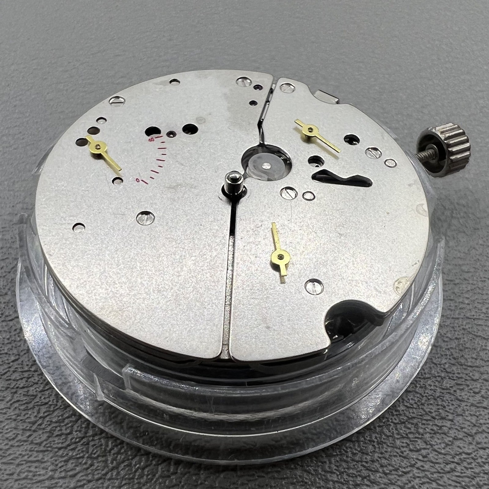 Tianjin ST17 T17 hand-wound watch movement with two hands and power reserve indicator at 10 o'clock.