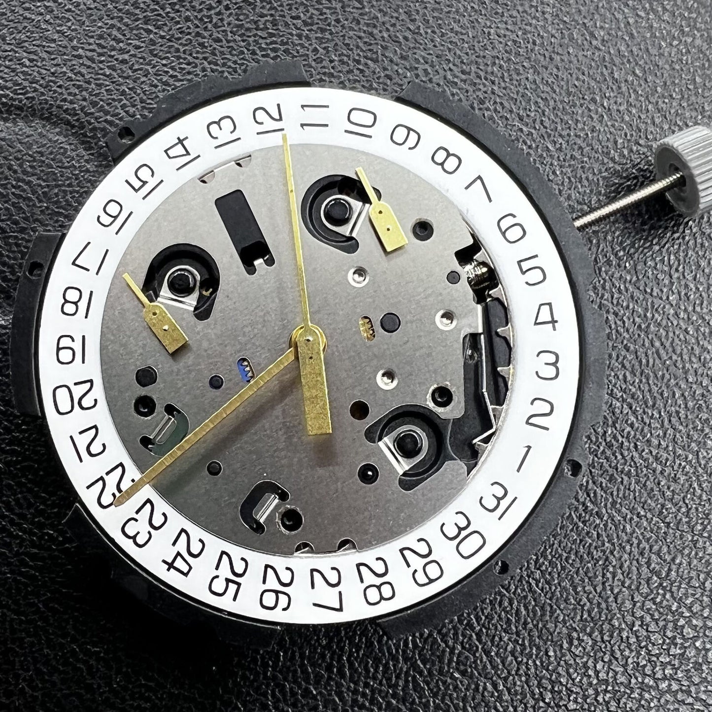 Swiss ETA G10.212 quartz watch movement showing 3 hands and date function for precision timing.