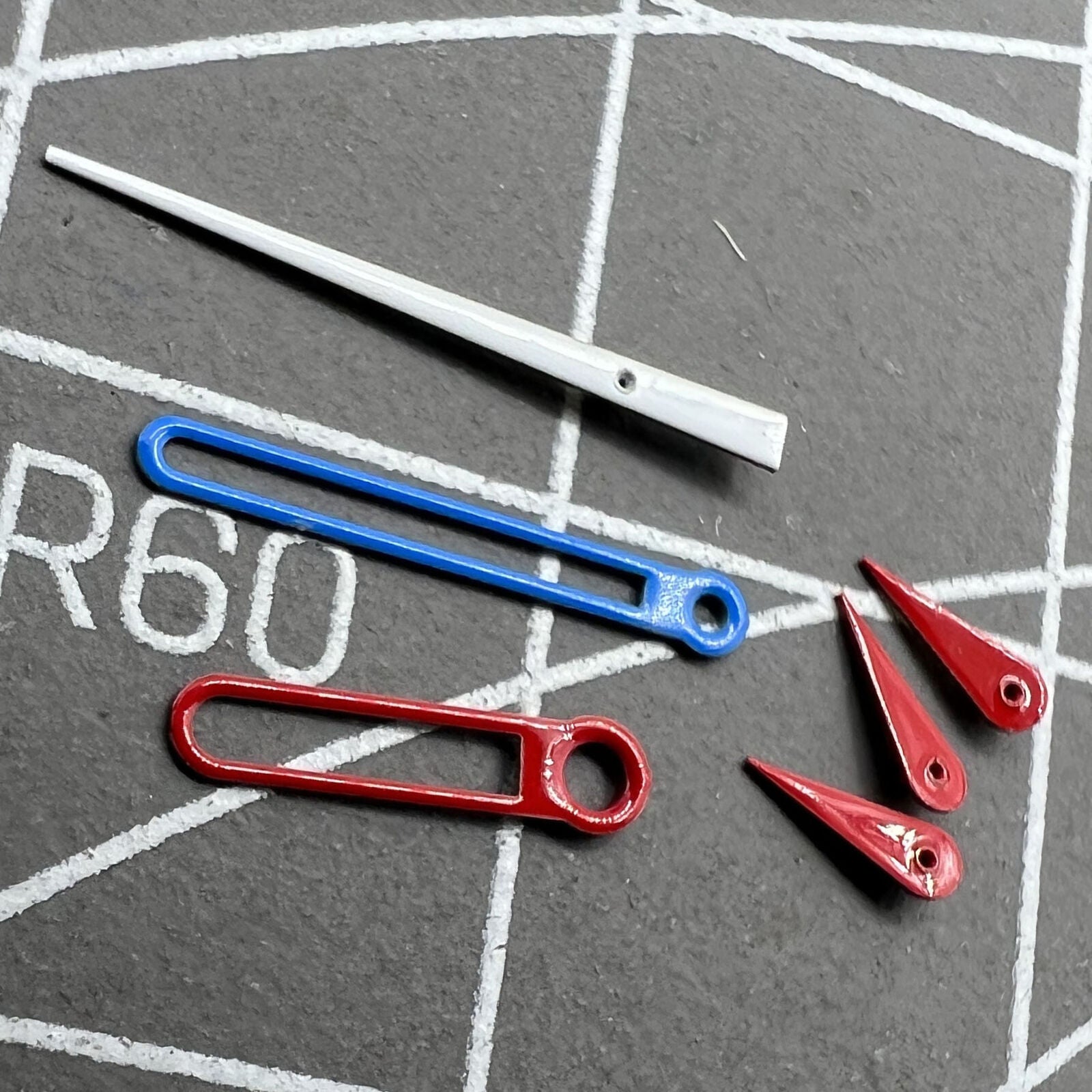 Red small second hand with blue and red trim for VD53, VD54, VD57 watch movements, precision accessory.