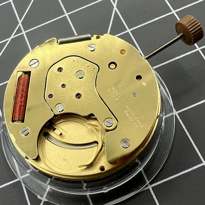 Golden Swiss Made Ronda 6004B quartz watch movement with date display at 12 o'clock, precise timekeeping by Ronda.