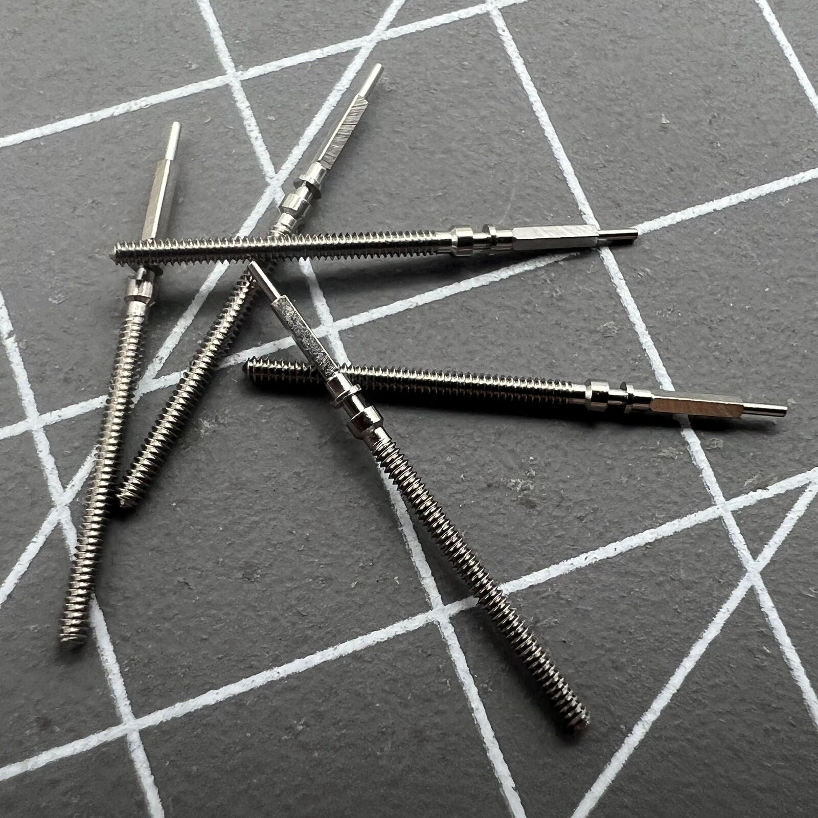 Watch winding stems for Omega 560, 561, 562, 564, 565 movements, precision spare parts.