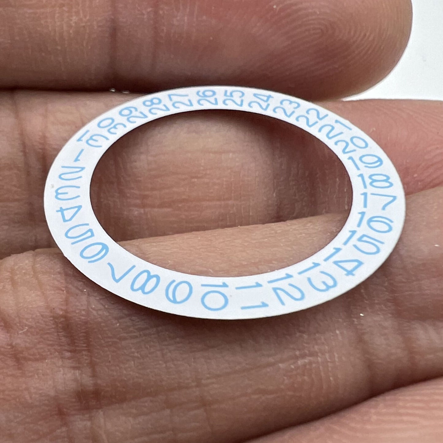 Sky blue date wheel disk for Miyota NH35 NH36 watch movement, white background, precise design.