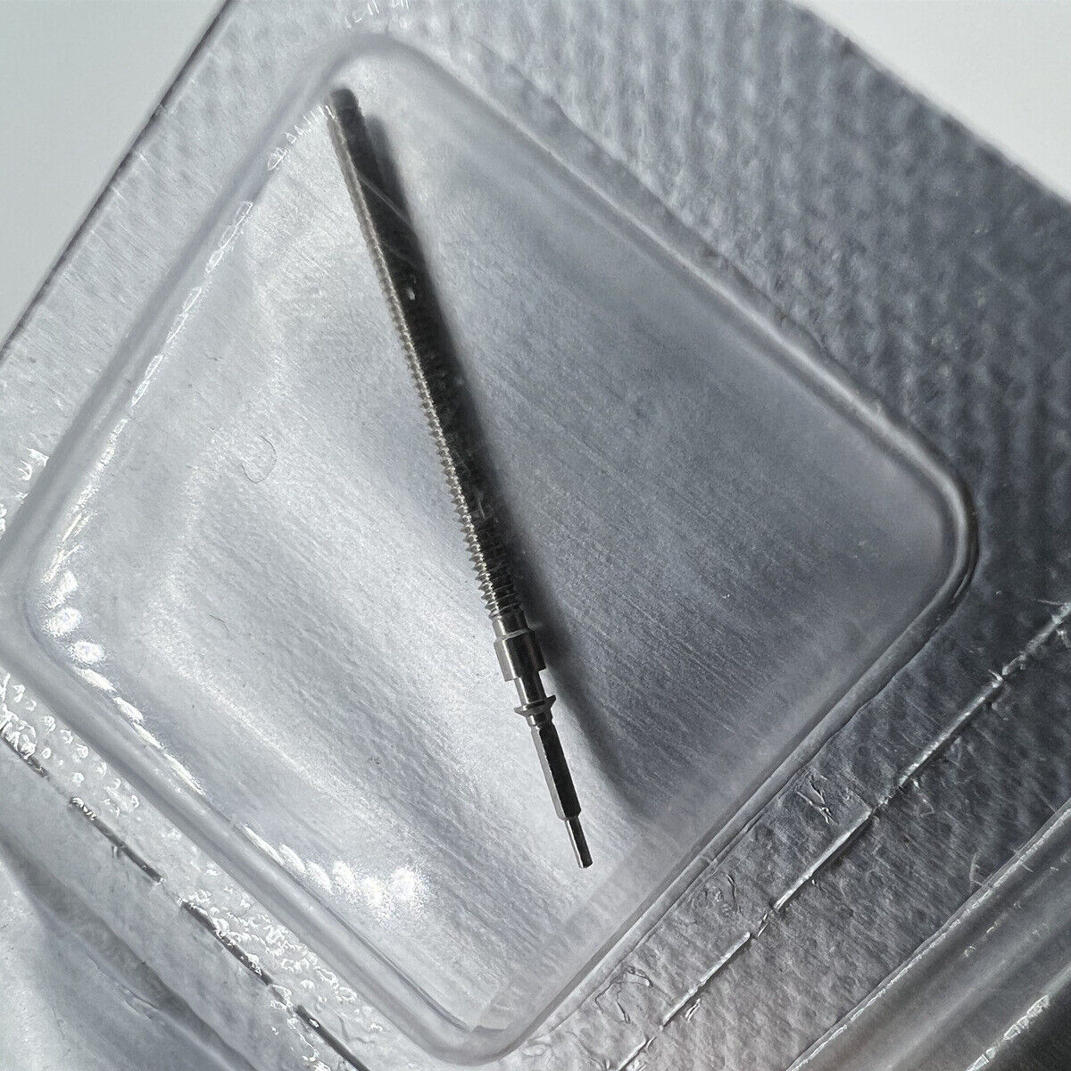 Set of 10 Swiss New Generic watch winding stems for ETA 955.112 and 956.112 movements, ideal for repairs.