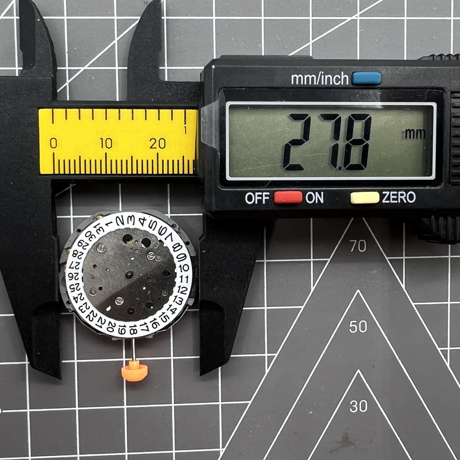 Miyota JS25 quartz watch movement with small second subdials at 3, 6, 9 and date display at 3.