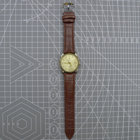 Dandong Peacock 37mm manual mechanical watch with golden dial, single calendar, 33 jewels, elegant design.