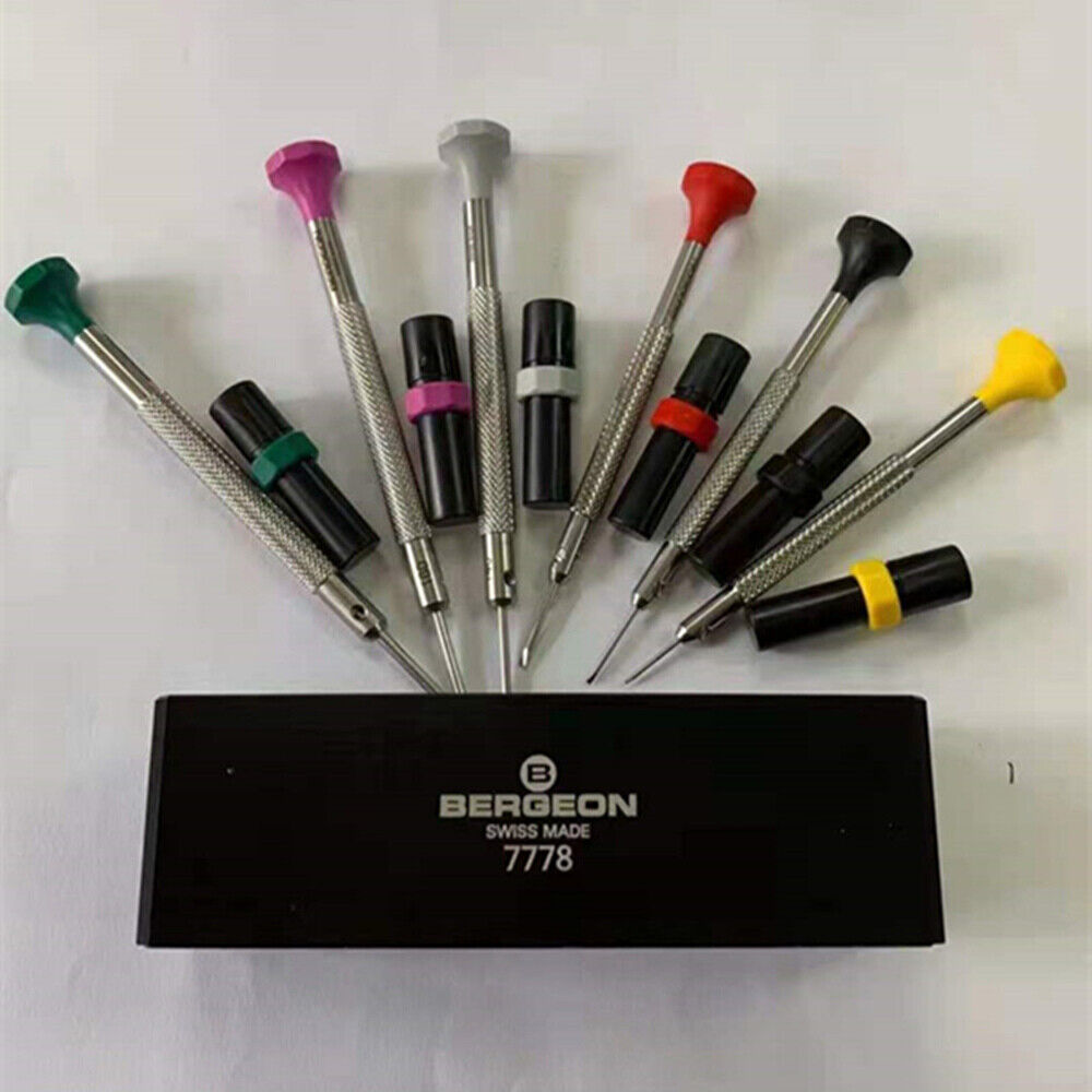 Swiss Bergeon 7778 watch screwdriver set with 6 precision blades, spare tips, and organizer stand for watch repair.