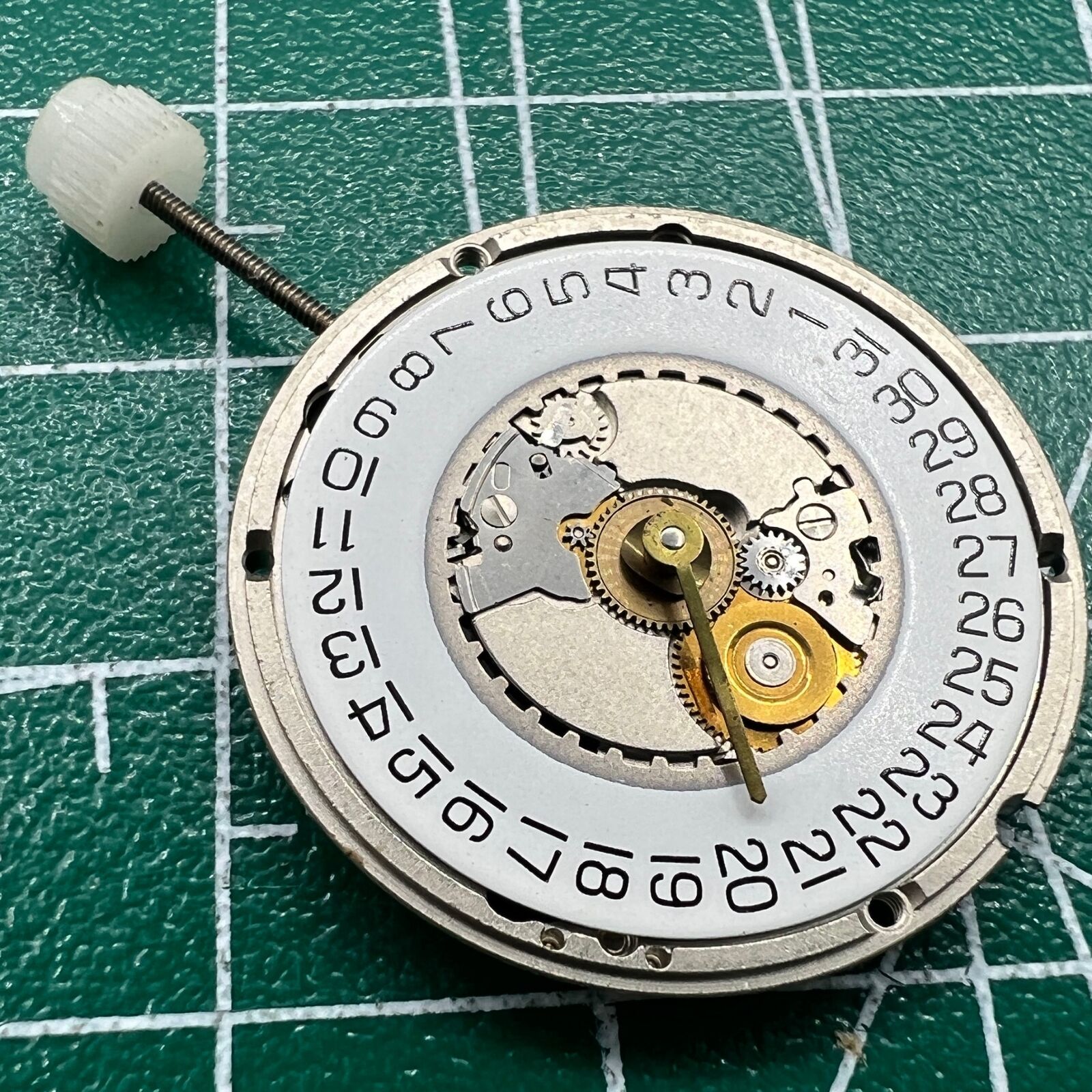 Swiss ETA 955.414 quartz movement with silver finish and date display at 3 o'clock by Wholesale.