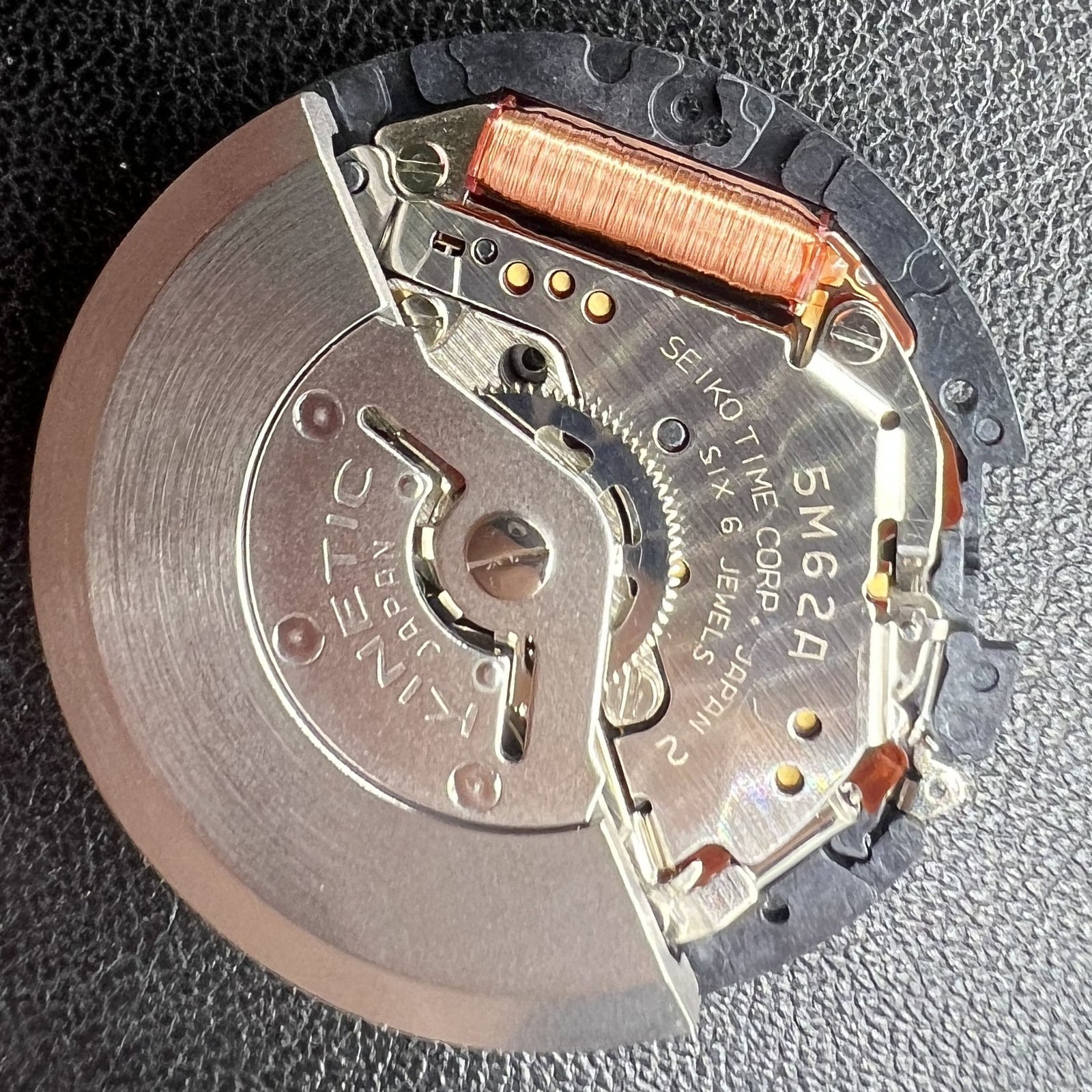 Seiko 5M62A quartz watch movement with date at 3 o'clock, reliable Japanese craftsmanship.