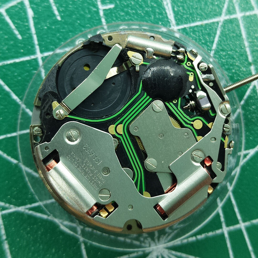 Swiss ISA 8162 quartz watch movement with date display at 6, precision replacement for watch repairs.