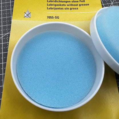Swiss Bergeon 7055-SG watch lubricant seals box with two silicone grease foam pads for accessories.
